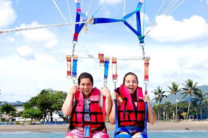 Adventure Combo: Party Boat Cruise & Parasailing - Catamaran Party Boat Cruise: Music, Drinks, and the Natural Pool Stop