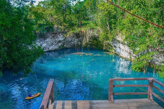 Full Day Tour to the Blue Lagoon and 7 Different Destinations - Laguna El Dudu and the Blue Lagoon moment: zipline gear and the jump