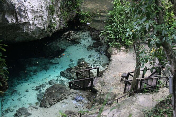 Full Day Tour to the Blue Lagoon and 7 Different Destinations - Playa Caleton: crescent shape, rocky character, and Taino carvings