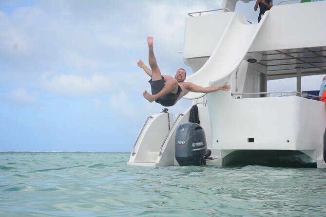 Private Catamaran with Sound system, Slide, Open bar & Snorkeling - Cruising Bávaro Beach With Your Music, Drinks, and Slide Energy