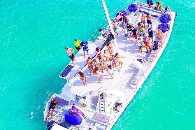 Private Sailing Catamaran - Onboard vibe: music, open bar, and the crew keeping things moving